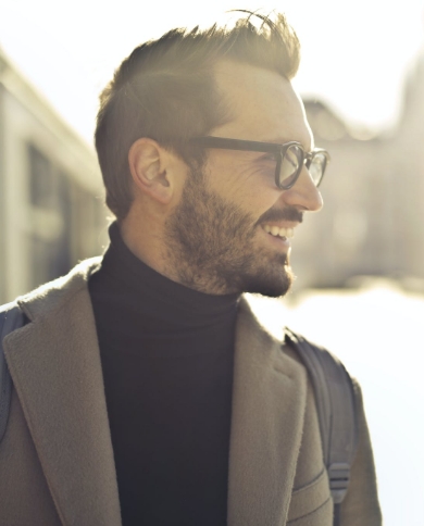 Man with great hair and glasses looking forward